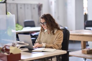 Woman at work using a content search solution.