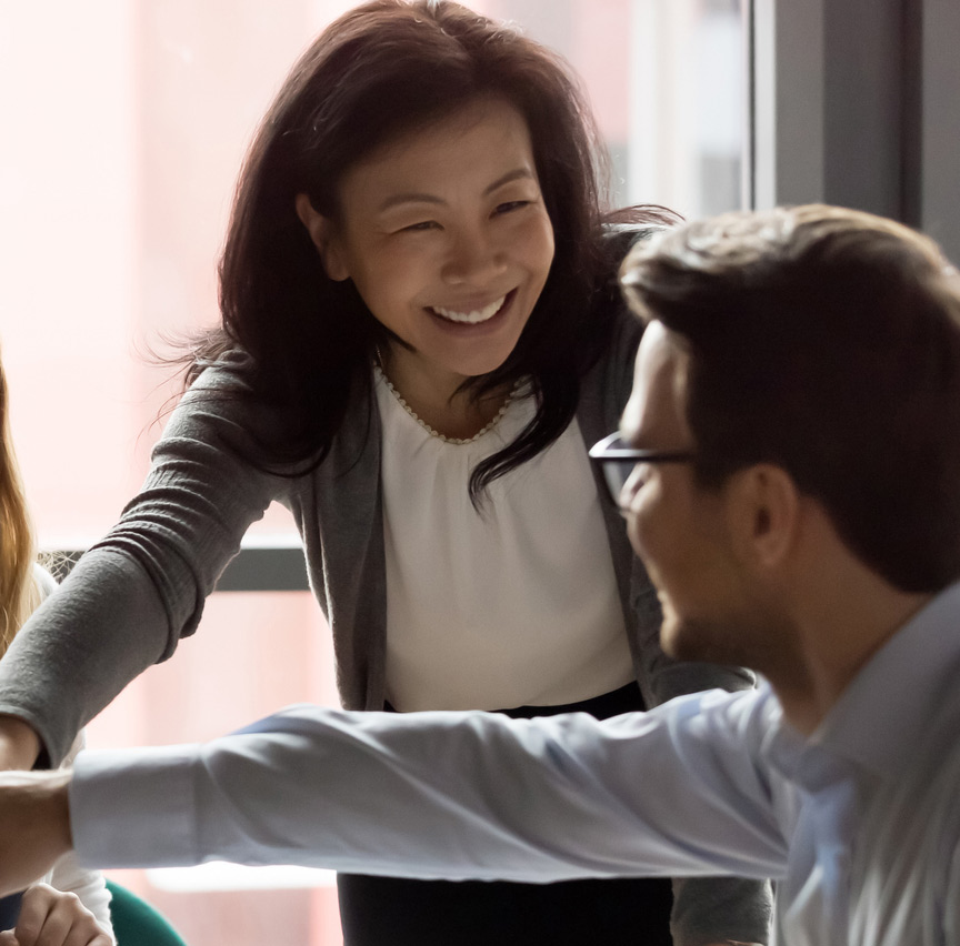 two people smiling at work