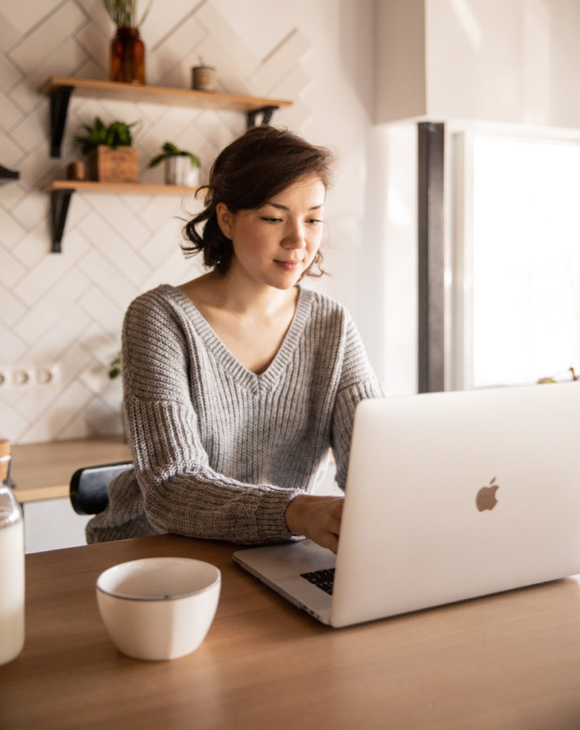 woman searching the cloud on her laptop